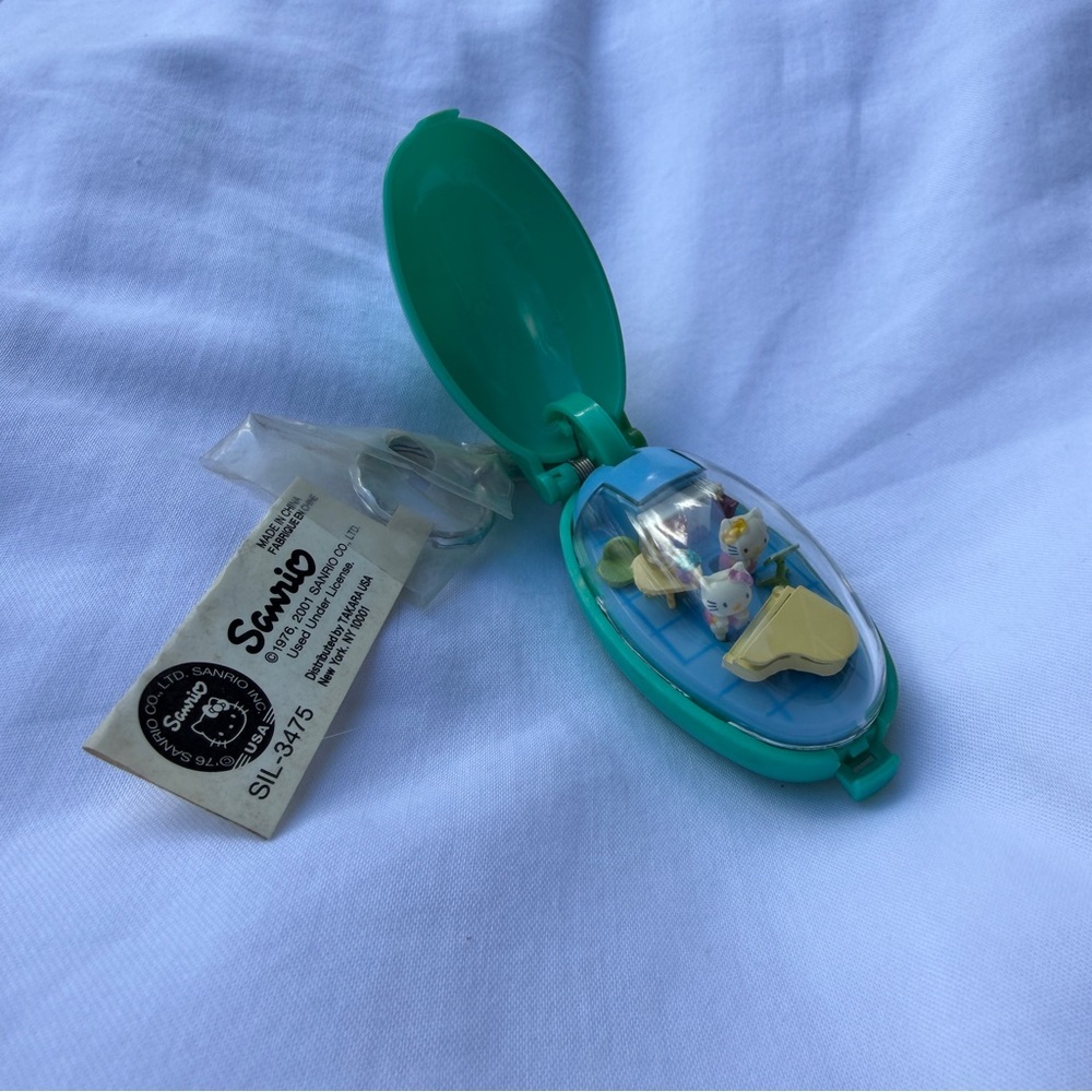 Vintage Hello Kitty pocket critter keychain